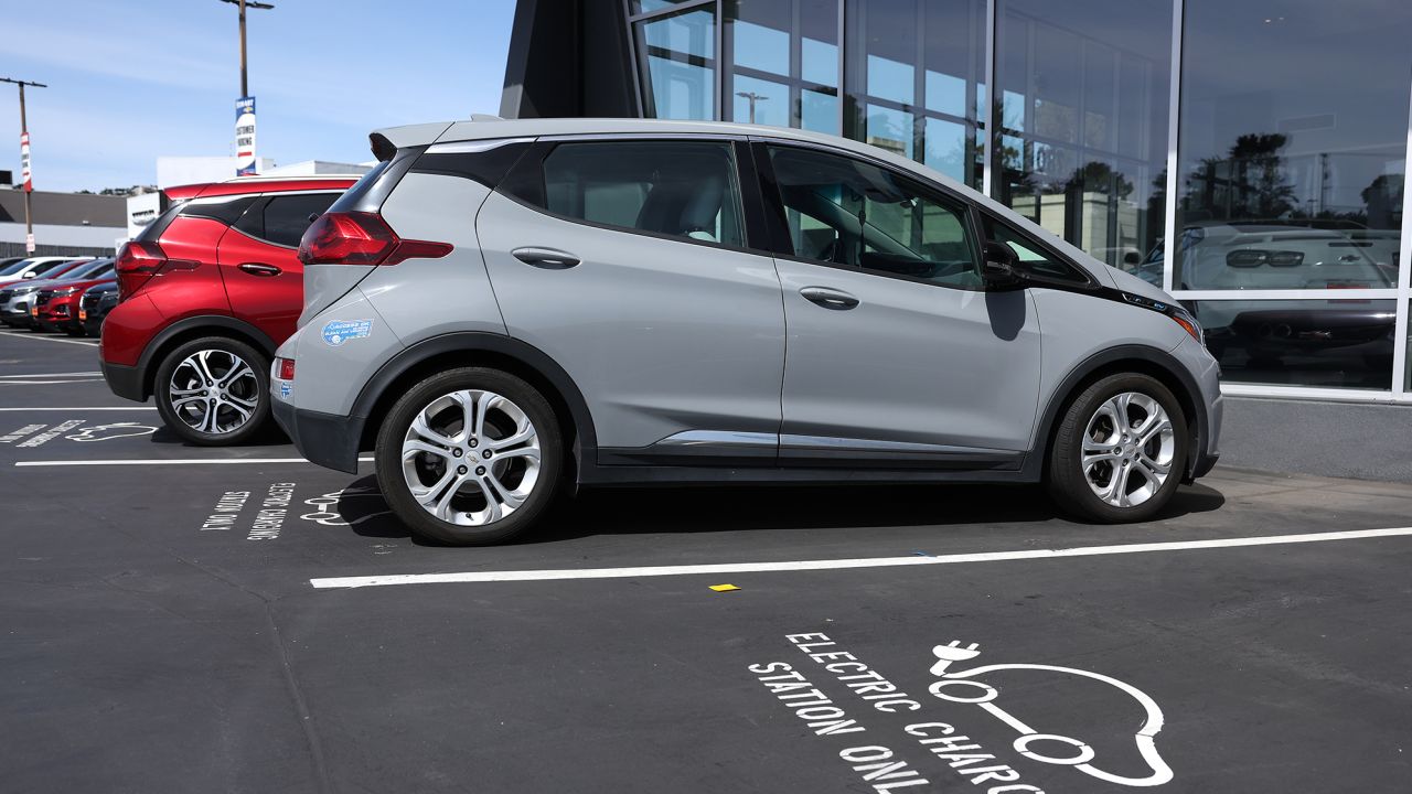 A Chevrolet Bolt EV sits parked at a charging station at Stewart Chevrolet on April 25, 2023 in Colma, California.