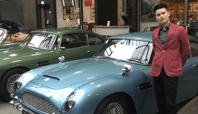 The author, Christoph Liu, standing next to an Aston Martin DB4