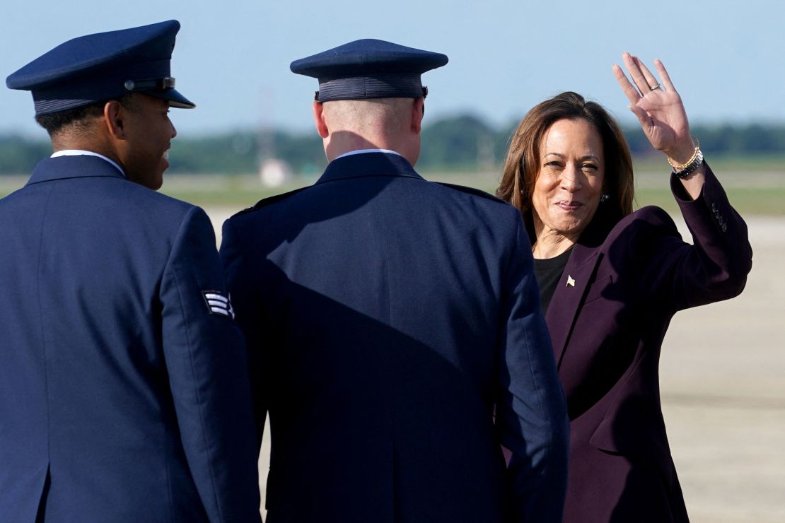 Vice President Kamala Harris gestures as she steps from Air Force Two upon arriving at Joint Base Andrews, Maryland, on August 23, 2024.